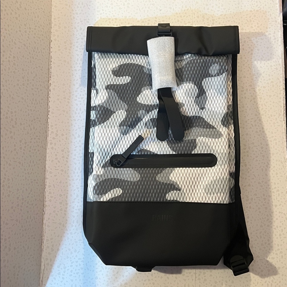 Rains rolltop rucksack camo. NWT.  Great Backpack.